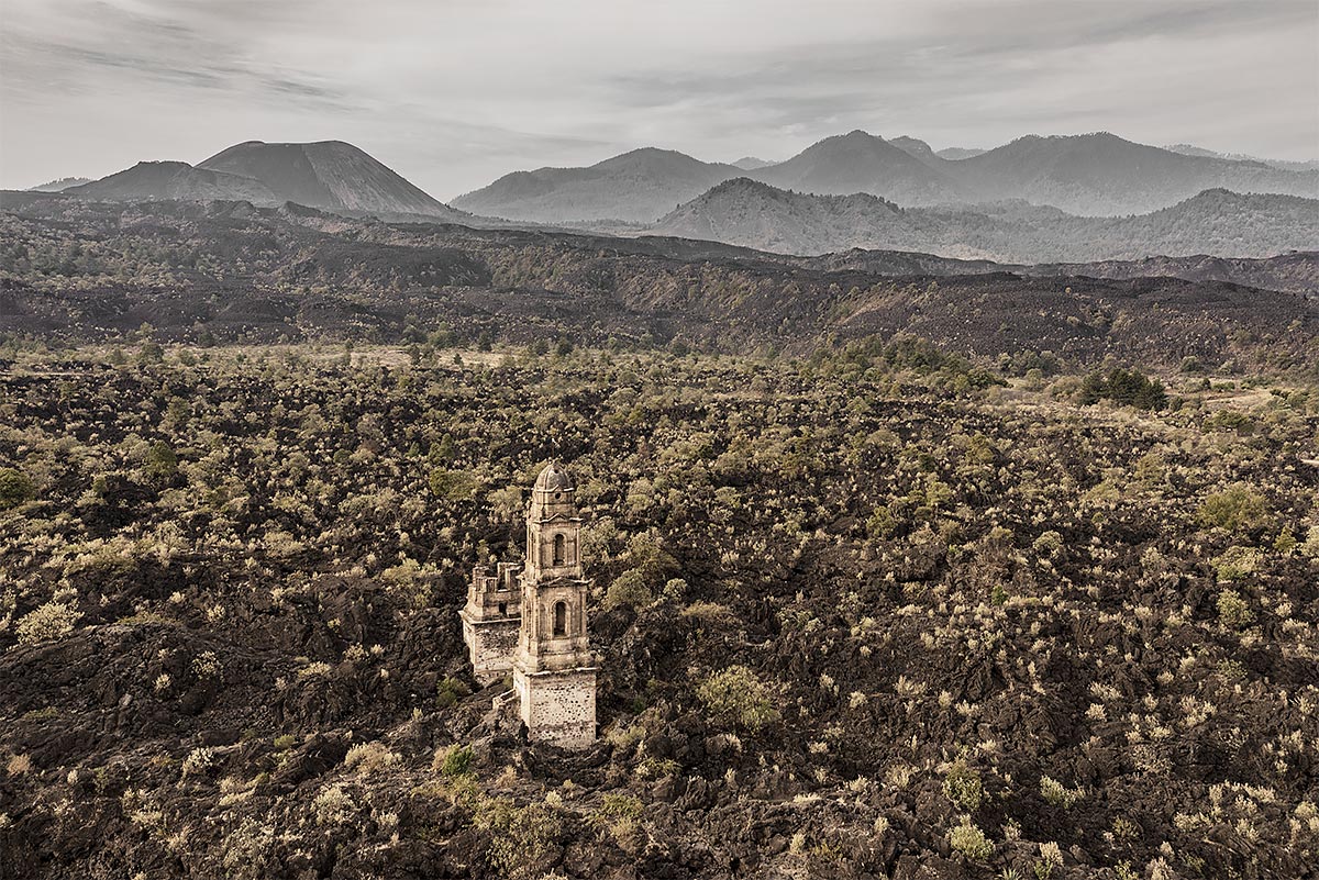 hand of god, faithless #83, mexico, 2016 (church tower still stands after lava flowing around it up to 15m high for 8y. Locals believe it was the hand of god)