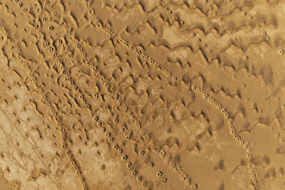 desert mole, leftscape #31, morocco, 2023 (250y old foggaras dug by slaves - an underground water system with vertical shafts, connected by a gently sloping tunnel which carries water to a lower oasis. left cuz motor pumps)